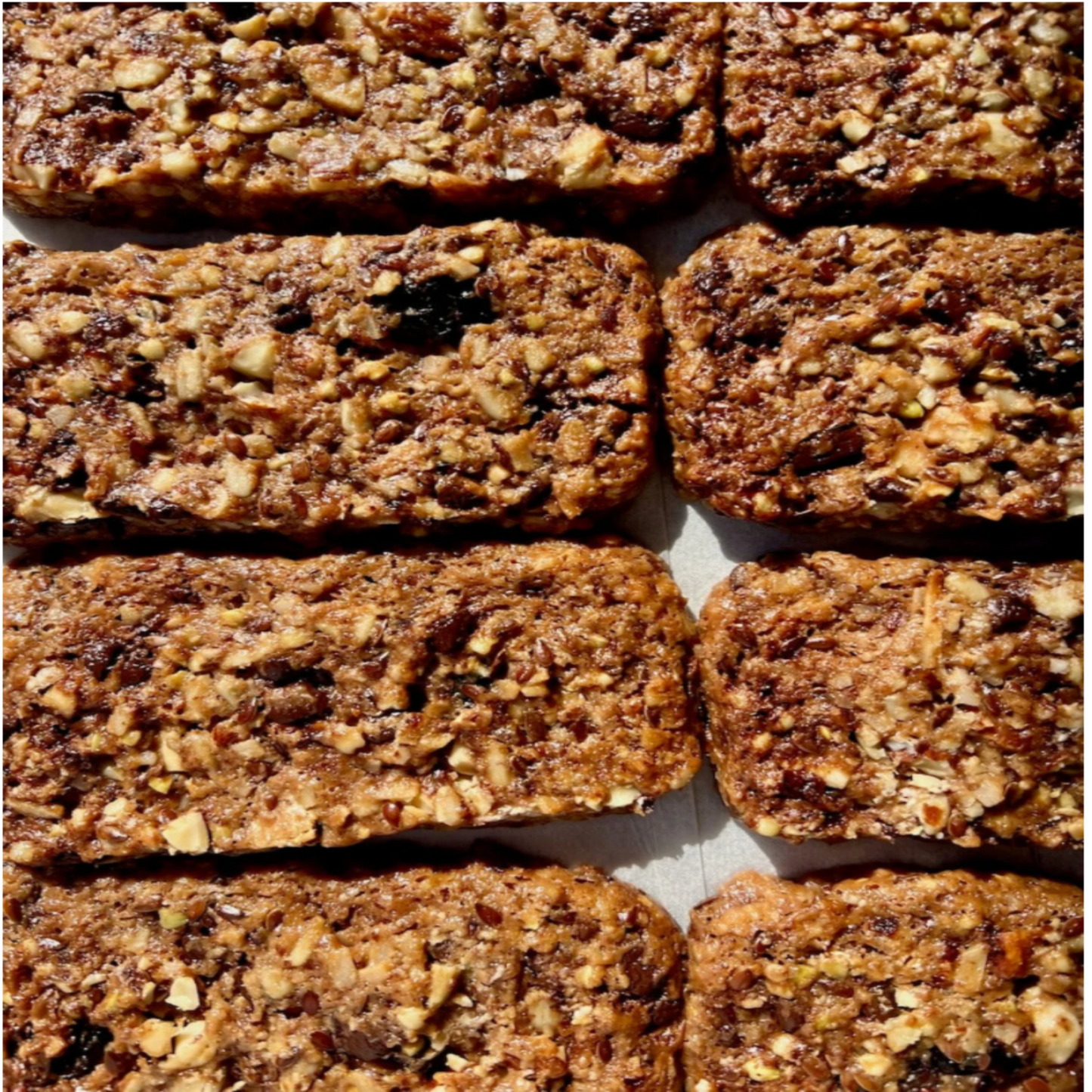 Dark chocolate & sour berry muesli bar, gluten-free and vegan-friendly.