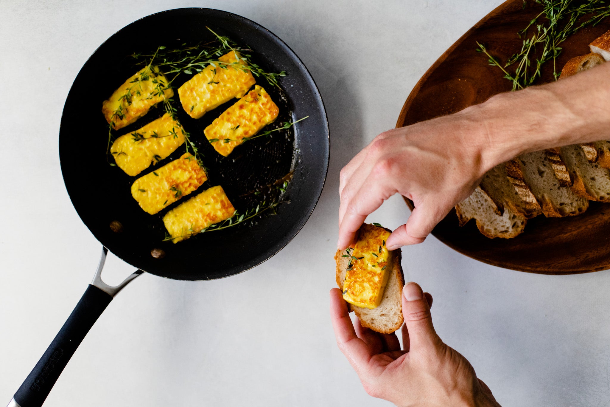 Pan fried turmeric halloumi served on toasted bread using turmeric and ginger paste.
